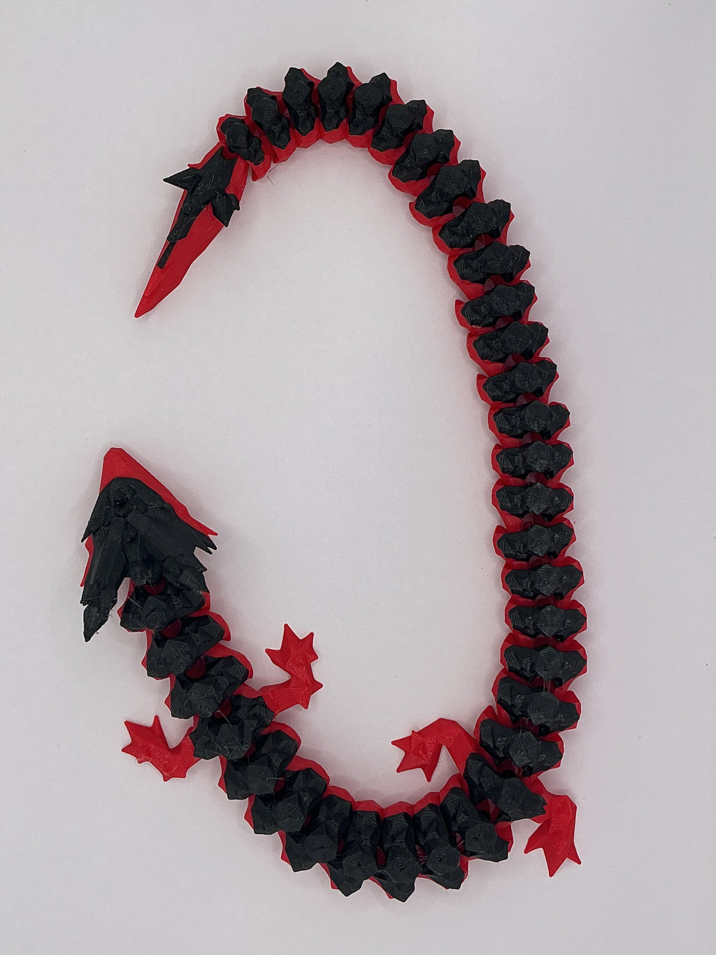 Flexi Dragon articulated 3D-printed fidget toy, close-up of joints