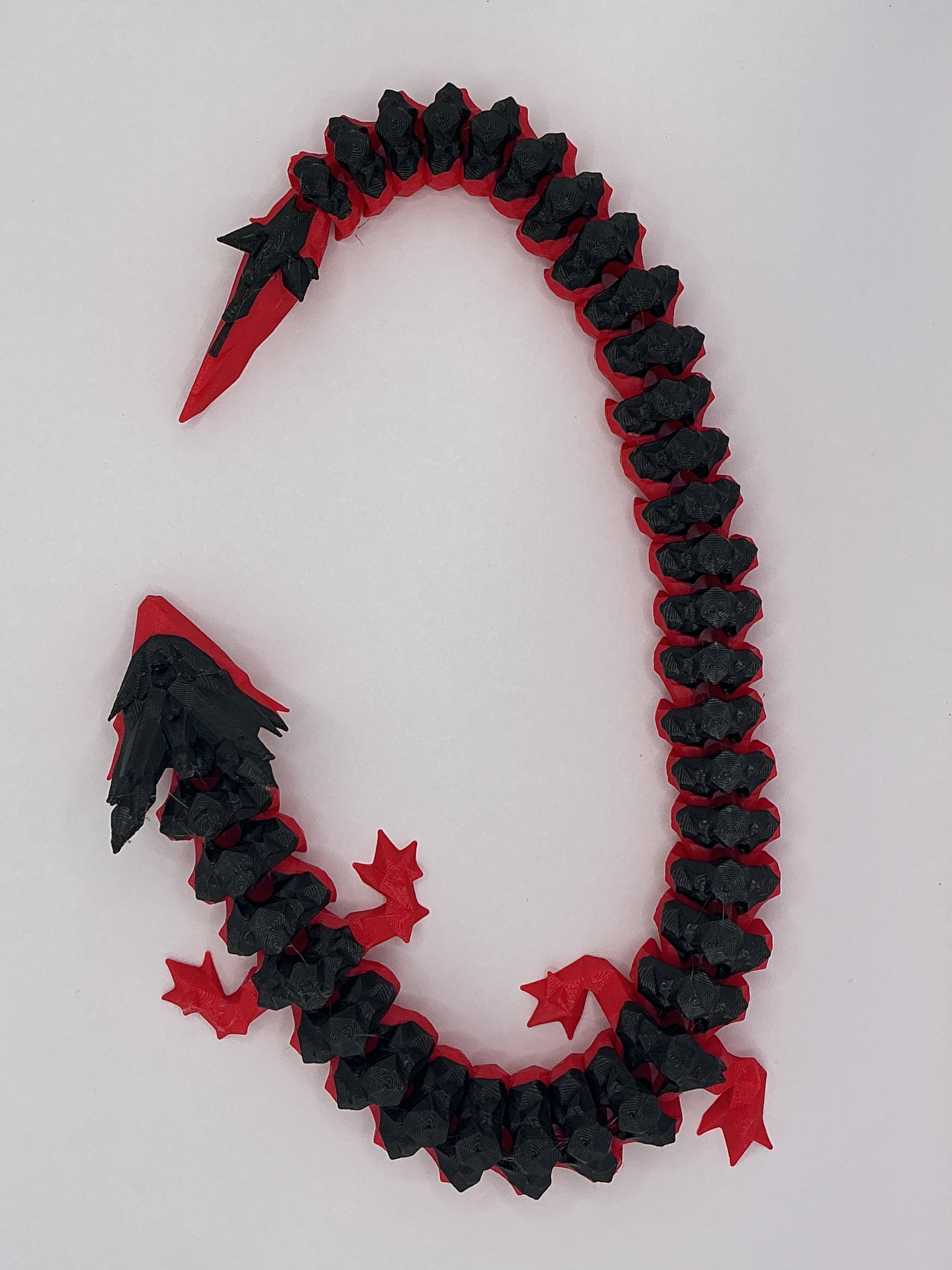 Flexi Dragon articulated 3D-printed fidget toy, close-up of joints